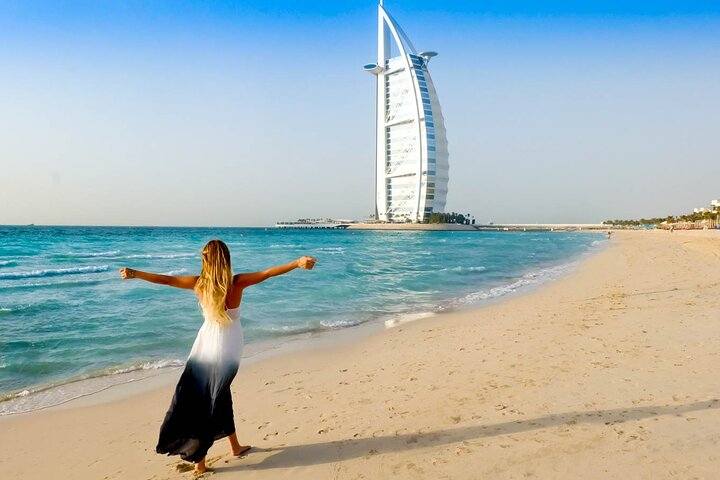 Experience the luxurious coastline of Jumeirah Beach where golden sands meet turquoise waters inviting you to relax and soak in the stunning views of Dubai's iconic skyline.